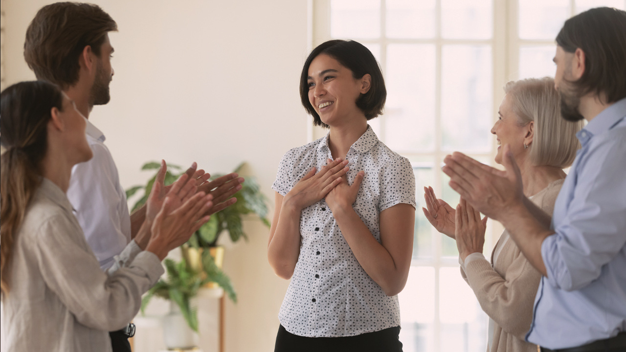 Woman getting social recognition from her colleagues
